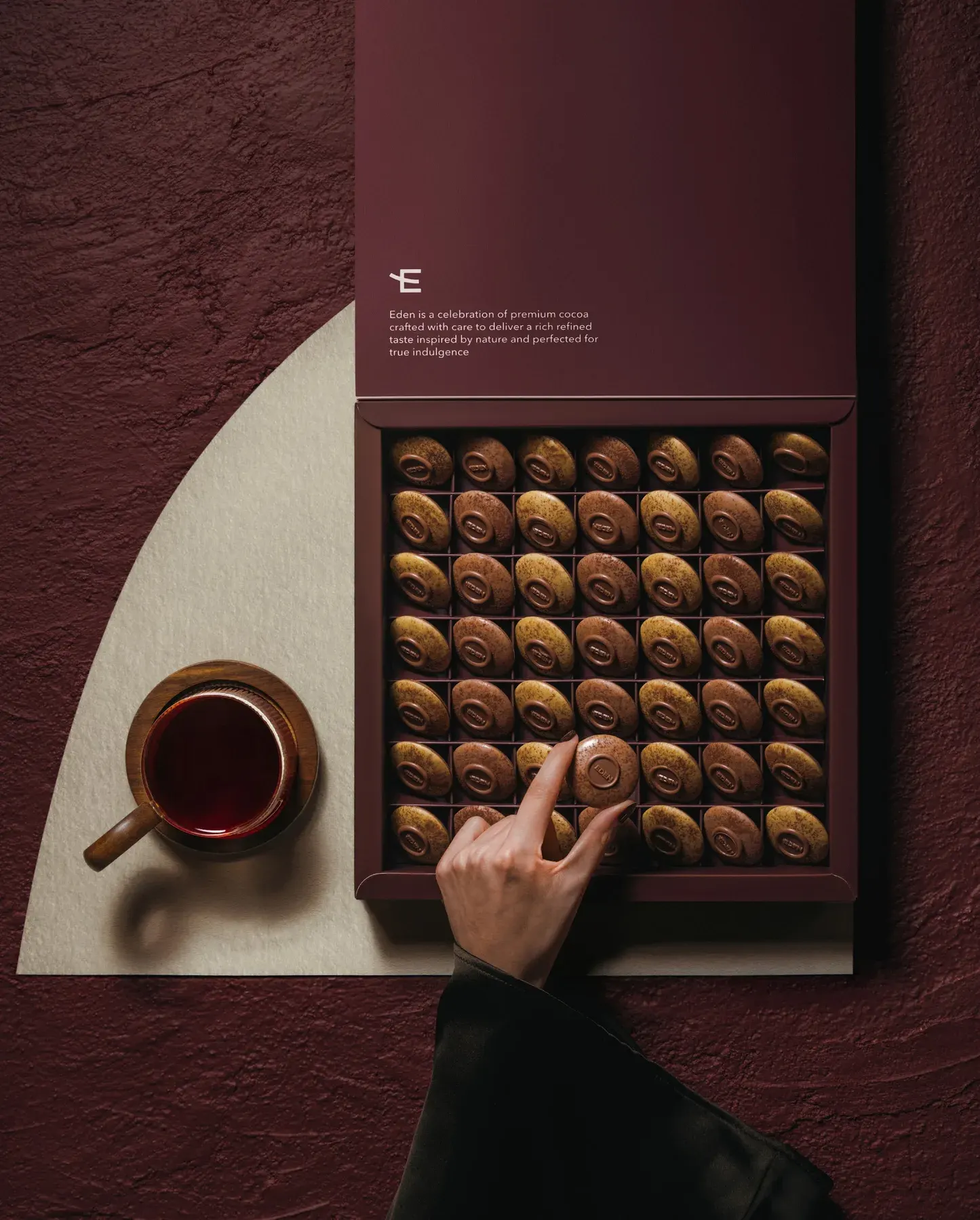 Eden Chocolatier Ramadan box opened on a maroon set