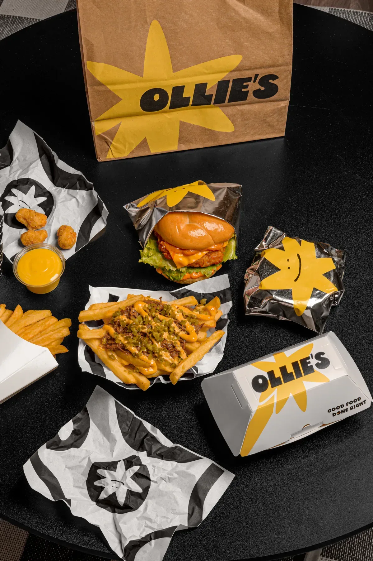 Ollie's packaging and food on a dark table